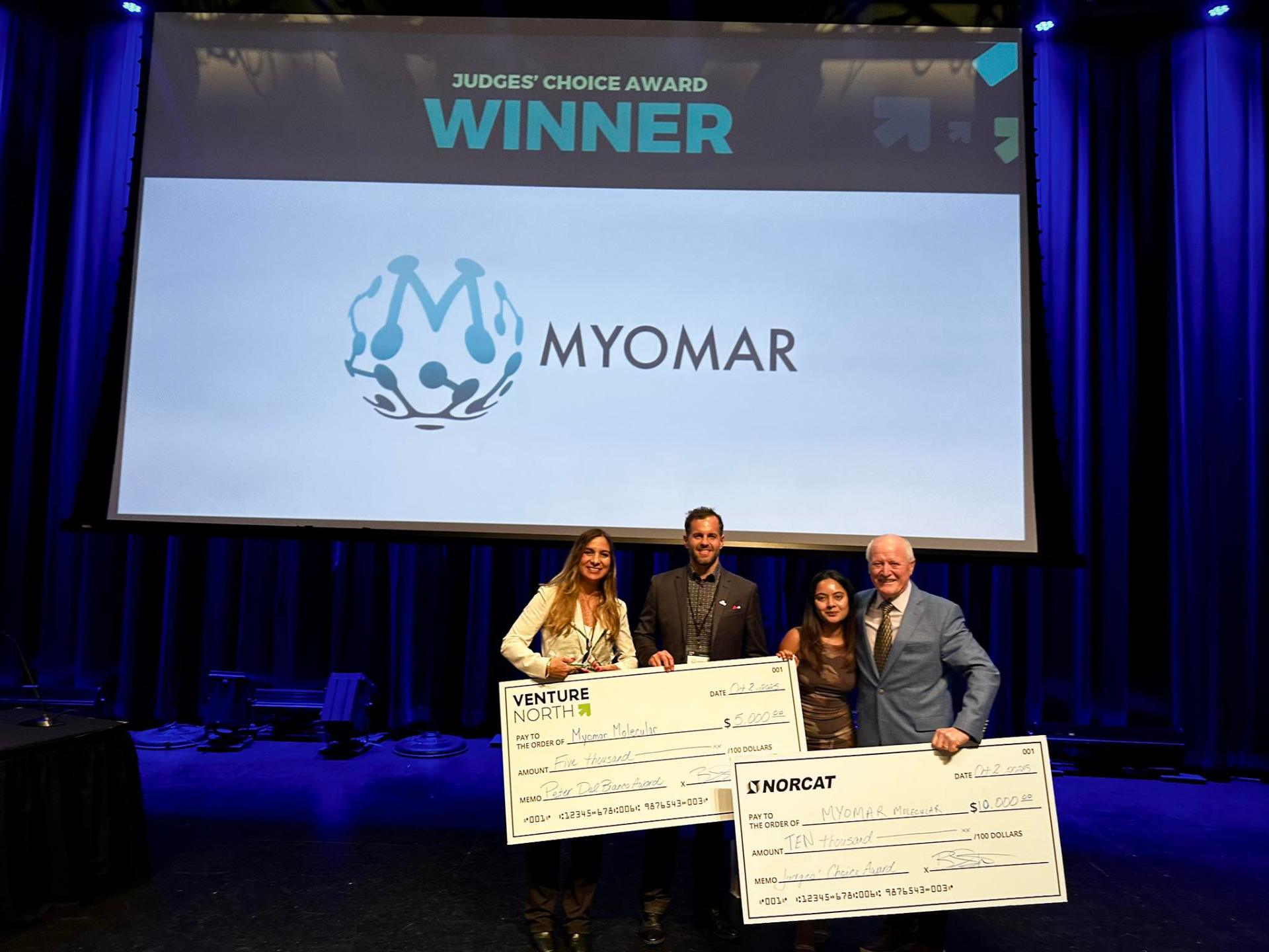 Myomar Molecular team accepting the Judges' Choice Award on stage at Venture North PITCH 2025.