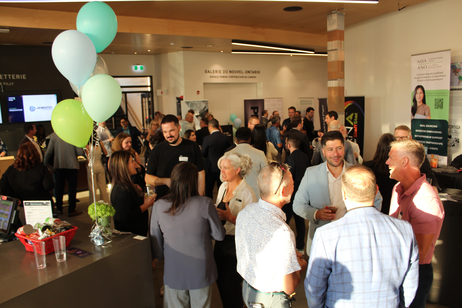 Founders, investors, and partners networking in the lobby at Venture North PITCH.